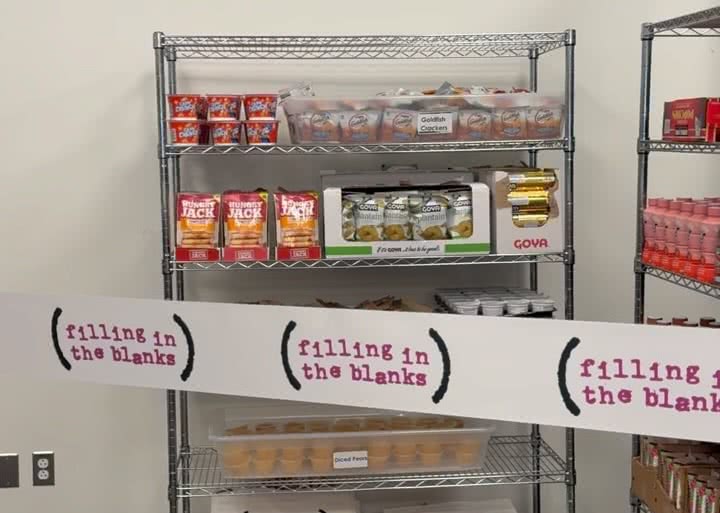 Pantry shelf with food. In front, barricade tape with the Filling in the Blanks logo printed on it